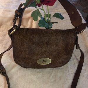 Amber Rose-brown/purse, front flap, fur, leather.